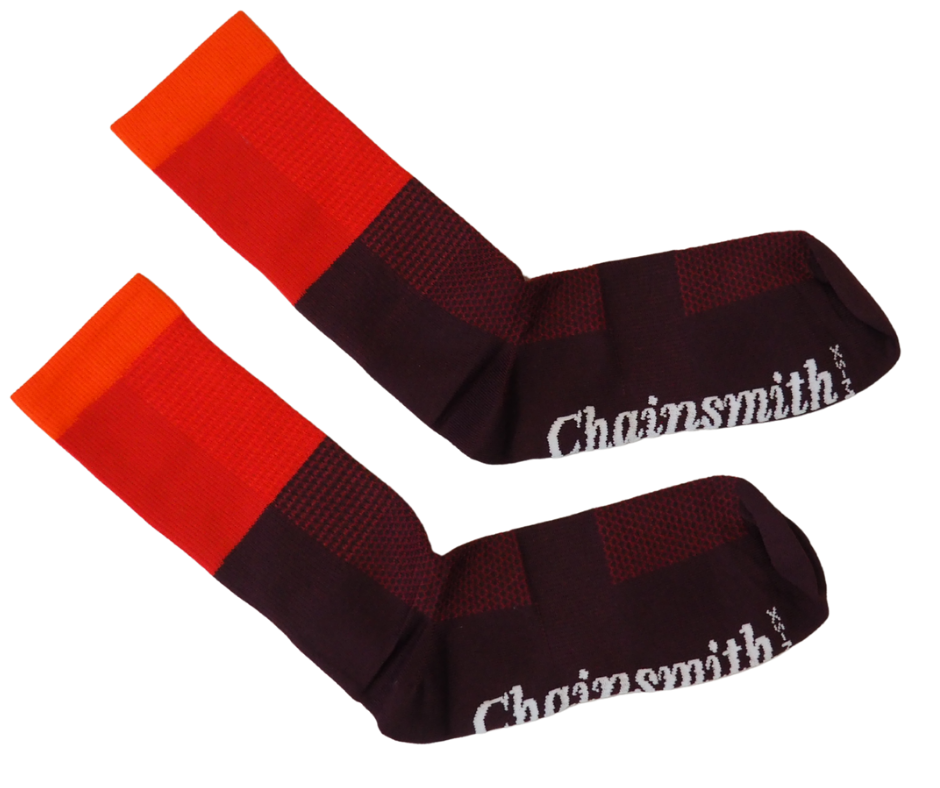 Flat lay of red tri-colour socks with branding visible on cuff