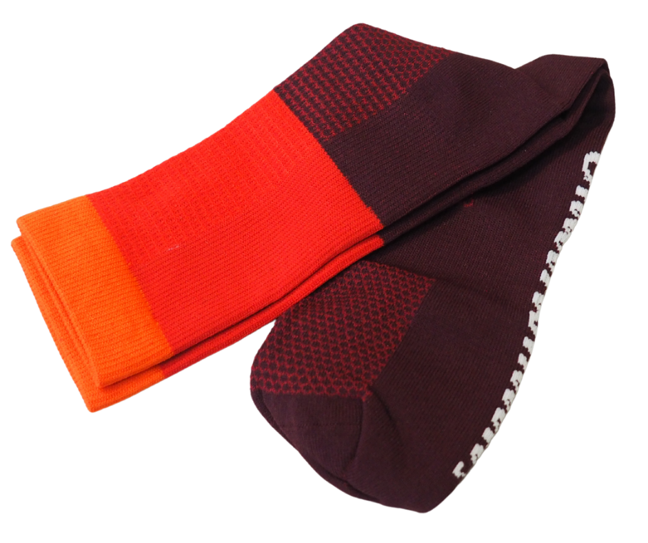 Close-up of breathable mesh knit on red cycling socks