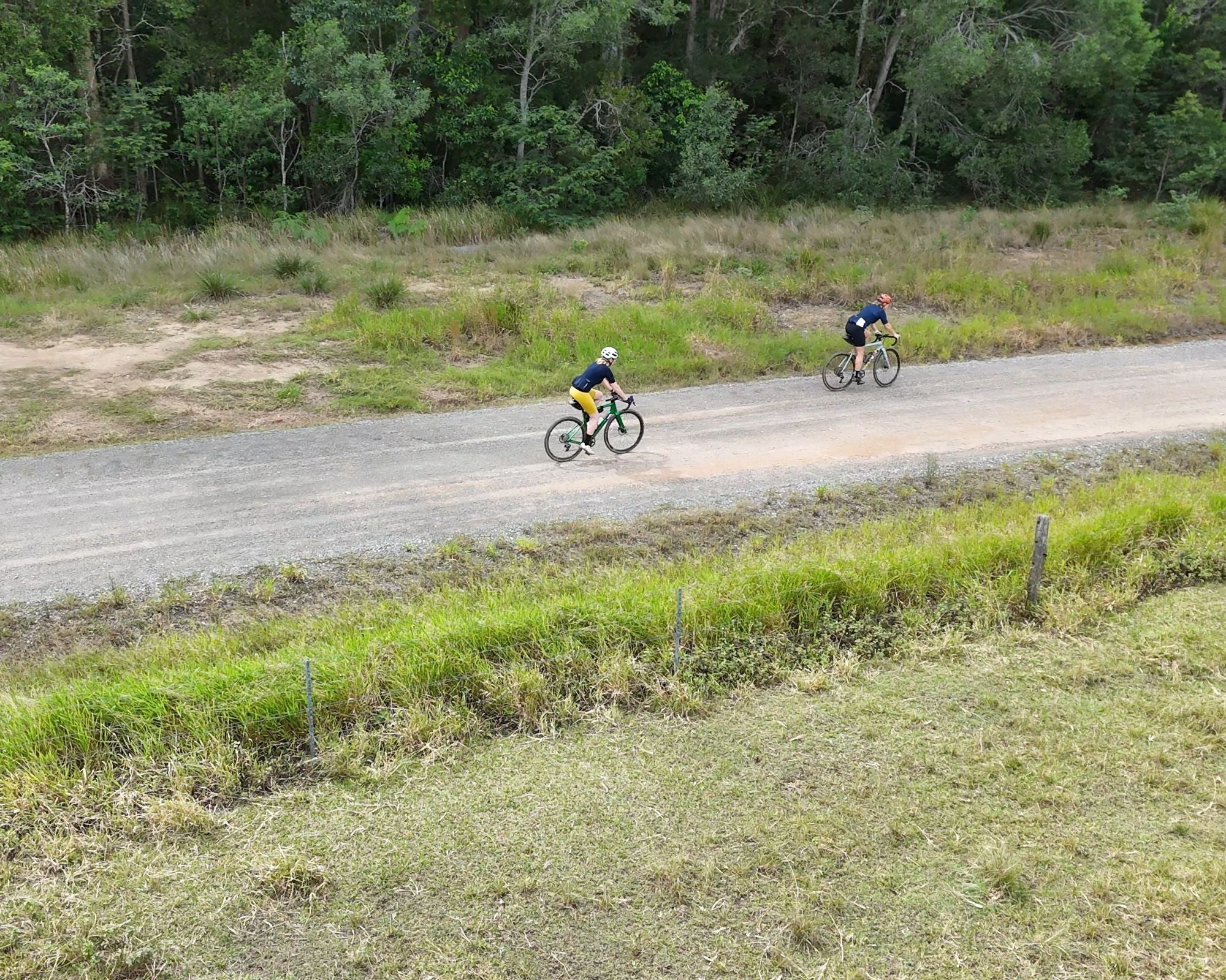 two gravel riders cycling on country roads on noosa trail network in qld