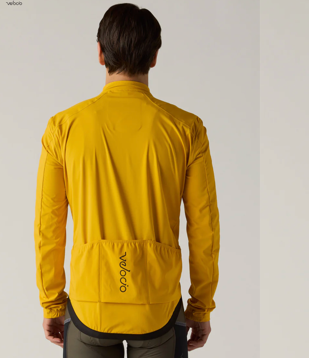 Rear view of Velocio ONE Jacket showing three rear storage pockets