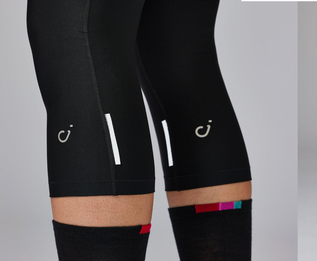 Side profile of Velocio ONE Knee Warmers showing anatomical cycling fit