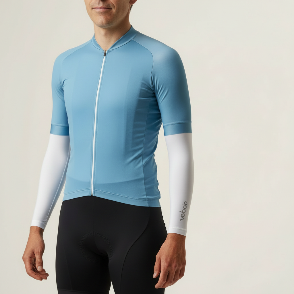 Light blue cycling jersey with white sleeves on a neutral background